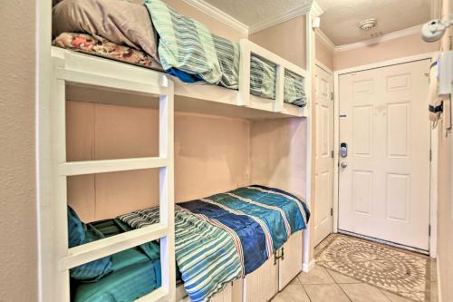 a small room with bunk beds and a closet at Oceanfront Corpus Christi Condo with Pool! in Corpus Christi