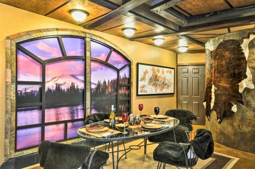 a dining room with a table and chairs and a large window at Willamette Valley Apt - Surrounded by Wineries! in Newberg