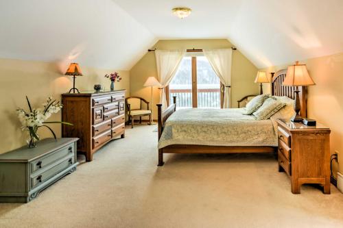 a bedroom with a bed and a dresser and a window at Mountaintop Ellicottville Home 7 Mi to Ski Resort in Ellicottville