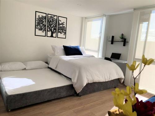 Katil atau katil-katil dalam bilik di Cozy loft in La Candelaria