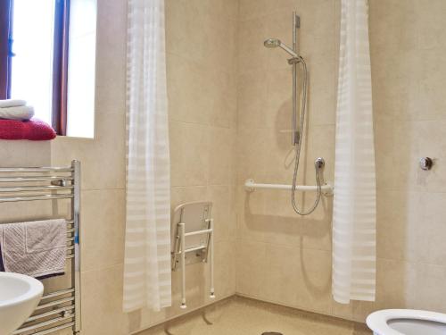 a bathroom with a shower and a sink at The Granary in Tytherton Lucas