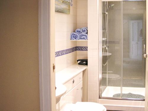 a bathroom with a shower and a toilet at Sea Views in Filey