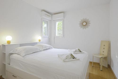 Postel nebo postele na pokoji v ubytování Appartement des 3 Couronnes - Welkeys