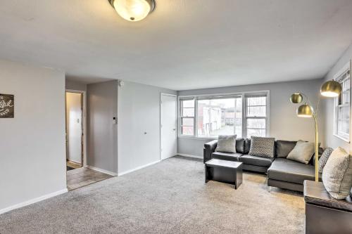 a living room with a couch and a table at Cozy Milwaukee Home 3 Mi to Whitefish Bay! in Milwaukee
