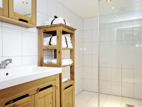 a bathroom with a sink and a shower at Stable Cottage - Hw7452 in Whitford