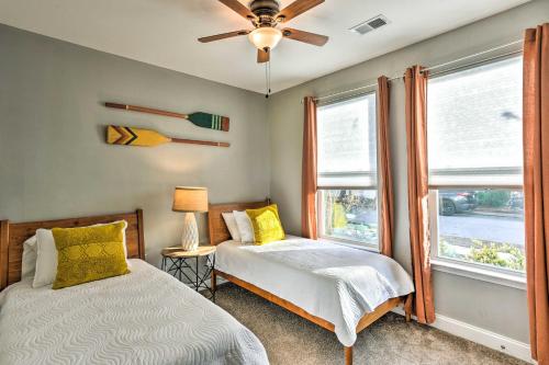 a bedroom with two beds and a ceiling fan at Coastal Getaway Less Than 1 Mi to Old Town Bluffton! in Bluffton