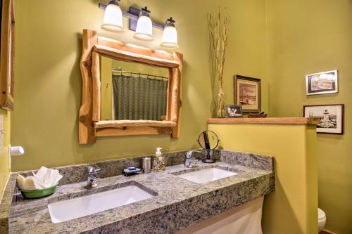 a bathroom with two sinks and a mirror at Unique Del Norte Getaway on 50 Private Acres! in Del Norte