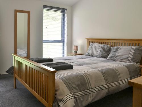 Säng eller sängar i ett rum på Heartwell Cottage