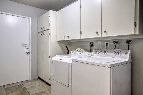 a white laundry room with a washer and dryer at Lakefront Tempe House with Sun Deck, Hot Tub and Boats in Tempe