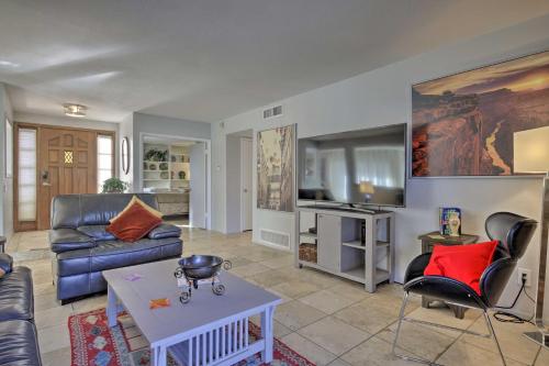 a living room with a couch and a table at Sun Deck, Hot Tub! Lakefront Tempe House in Tempe