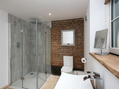 a bathroom with a glass shower with a toilet at The Coach House - Ukc2365 in Watton