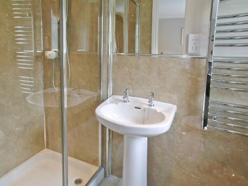 a bathroom with a sink and a shower at Kerrera View in Oban