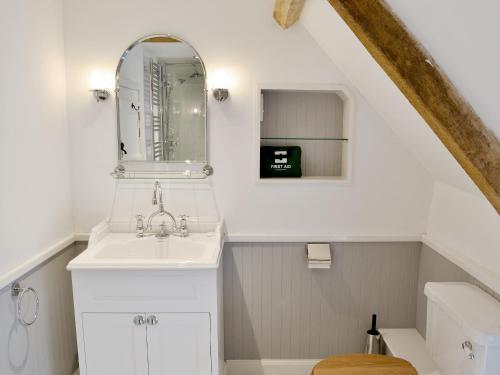 a bathroom with a sink and a mirror at Dairy House Farm in Hatch Beauchamp