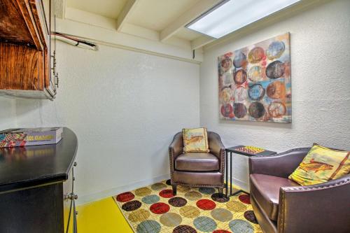 a waiting room with two chairs and a painting at Lakefront Retreat with Dock, Paddle Boards and Kayaks! in Clearlake