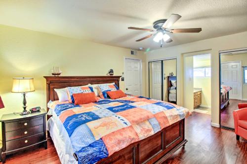 a bedroom with a bed and a ceiling fan at Lakefront Retreat with Dock, Paddle Boards and Kayaks! in Clearlake