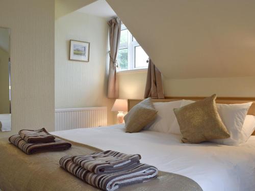Postel nebo postele na pokoji v ubytování Boatland Lodge