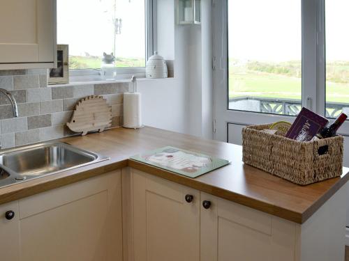 a kitchen with a sink and a counter top at Salem Fach - Hw7587 in Llanrhwydrys