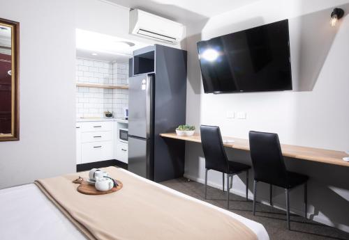 Кухня или мини-кухня в City Centre Motel Armidale
