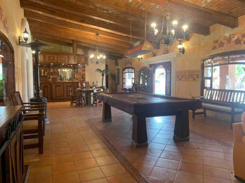 a large room with a large pool table in it at Quinta El Rosario maravilloso lugar in Lagos de Moreno