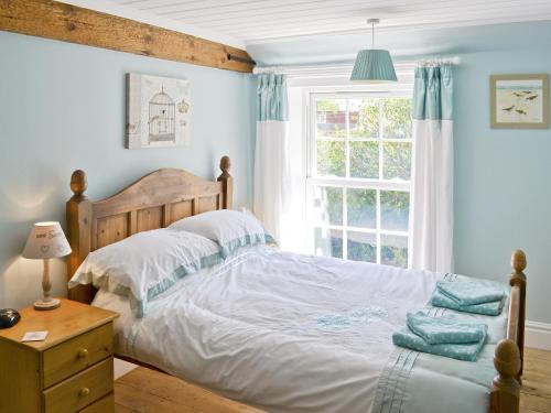 Postel nebo postele na pokoji v ubytování South View Cottage