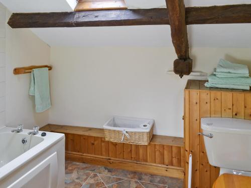 a bathroom with a toilet and a sink at The Corn Mill in Branthwaite