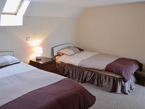 Katil atau katil-katil dalam bilik di Sandy Brae Cottage