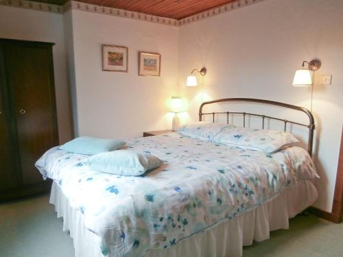 Un pat sau paturi într-o cameră la 15 Cairnbaan Cottage