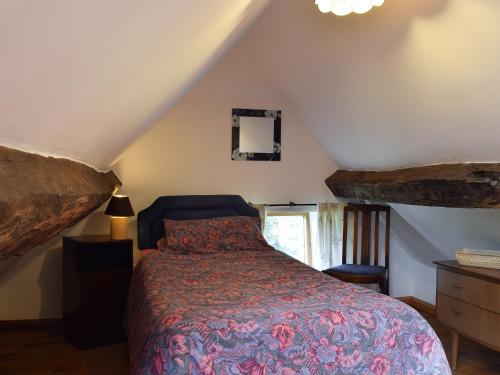 a bedroom with a bed in a attic at The Cider Press in Welland