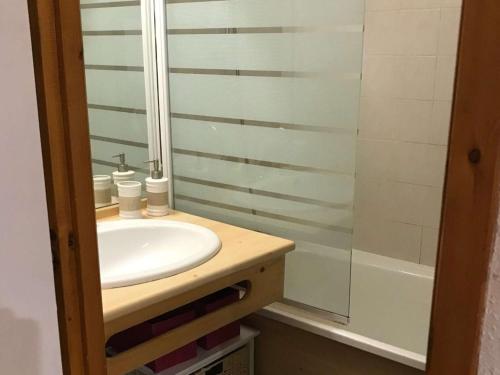 a bathroom with a white sink and a shower at Appartement Arêches-Beaufort, 2 pièces, 5 personnes - FR-1-342-144 in Beaufort