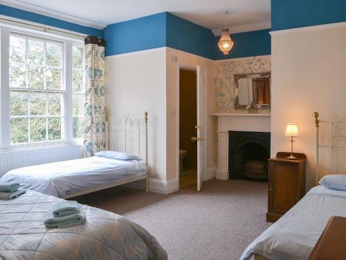 A bed or beds in a room at Blaithwaite House