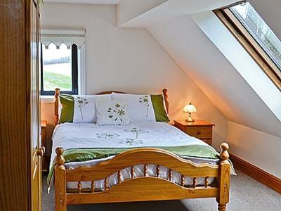 a bedroom with a bed and a window at Myton House in Thornton Steward