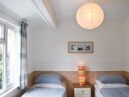 Postel nebo postele na pokoji v ubytování Cockle Cottage