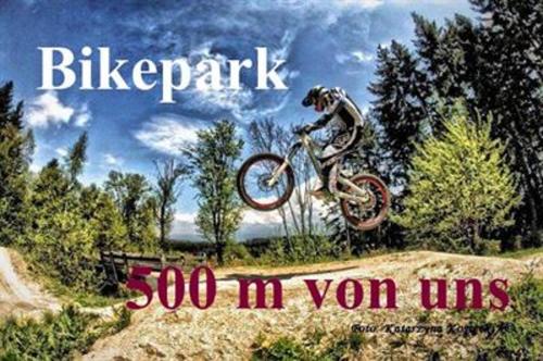 a man doing a trick on a dirt bike in the air at Hotel Schäfflerhof in Bischofsmais