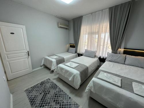 Säng eller sängar i ett rum på Otel NİL FIRAT
