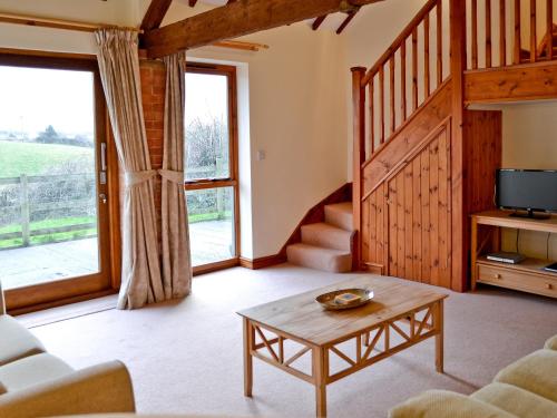 a living room with a couch and a table at Torridge in Great Torrington