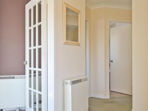 a door leading into a room with a closet at Seaview Repose in Leurbost