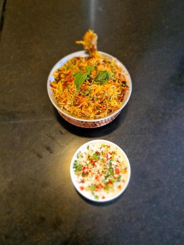 two bowls of food sitting on a table at Udman Hotel Haridwar in Haridwār