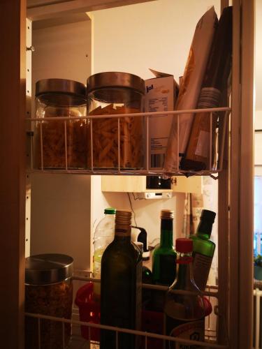 a refrigerator filled with lots of bottles and food at Stellina in Eitorf