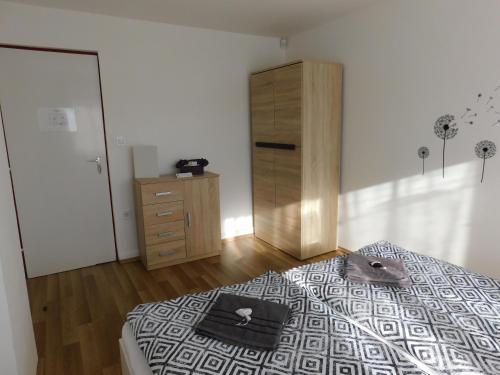 Кровать или кровати в номере 8888 Vendégház