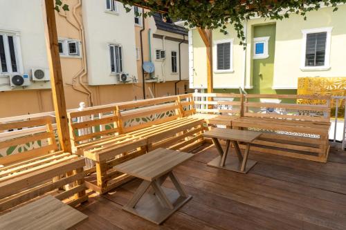 a group of benches sitting on a balcony at Spectacular 3/4-Bed-Apt With 24hrs Power And FAST Wi-Fi in Amuwo