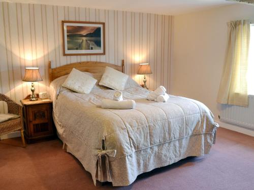 a bedroom with a bed with two towels on it at Bestdale in Frosterley