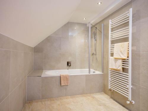 a bathroom with a bath tub and a shower at Apart Agnes in Obergurgl