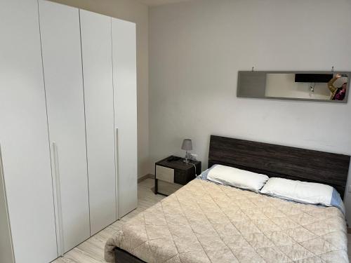 A bed or beds in a room at Le case di Lulù