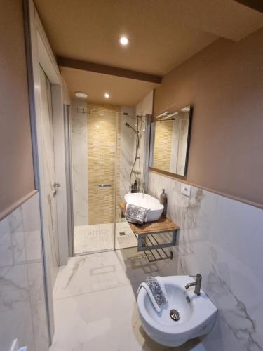 a bathroom with a sink and a toilet and a shower at Dimora Pepatio in Camporosso
