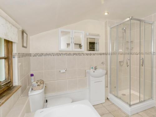 a bathroom with a shower and a toilet and a sink at The Croft - 28243 in Sible Hedingham