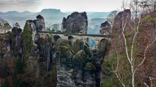 a bridge on the side of a mountain at Ferienwohnung Gisela Winkler in Rathen