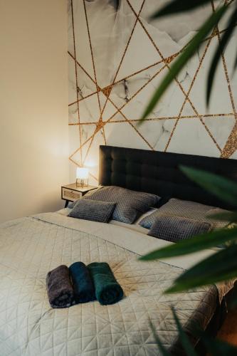 a bedroom with a bed with two pillows on it at Apartmány J&J in Šumperk