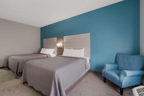Кровать или кровати в номере Quality Inn & Suites Aiken South
