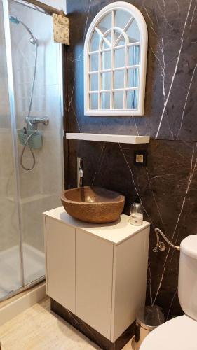 a bathroom with a sink and a shower at Casa Alegria in Calafat