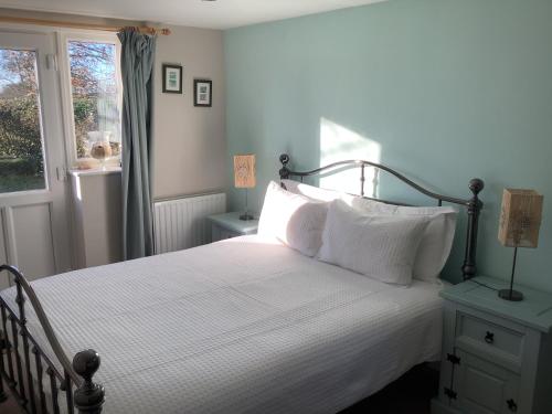 Ένα ή περισσότερα κρεβάτια σε δωμάτιο στο Villa Farm Cottage